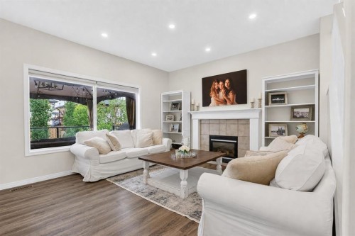 168 West Springs Close Sw, Calgary, AB - Indoor Photo Showing Living Room With Fireplace
