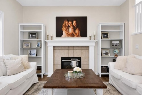 168 West Springs Close Sw, Calgary, AB - Indoor Photo Showing Living Room With Fireplace