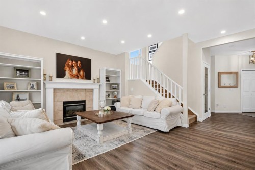 168 West Springs Close Sw, Calgary, AB - Indoor Photo Showing Living Room With Fireplace