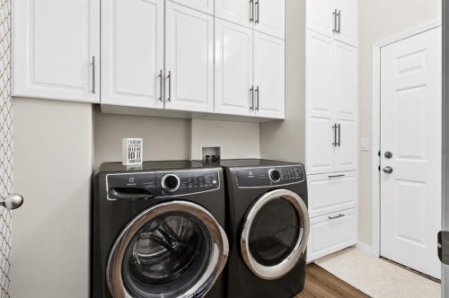 168 West Springs Close Sw, Calgary, AB - Indoor Photo Showing Laundry Room