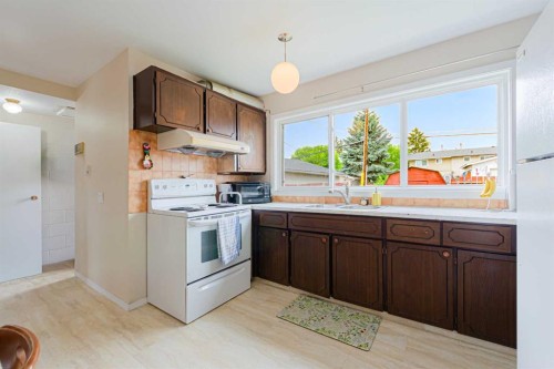 5412 14 Avenue Se, Calgary, AB - Indoor Photo Showing Kitchen With Double Sink