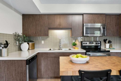 1205-250 Sage Valley Road Nw, Calgary, AB - Indoor Photo Showing Kitchen With Stainless Steel Kitchen With Double Sink With Upgraded Kitchen