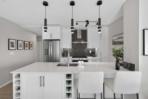 302-2231 Mahogany Boulevard Se, Calgary, AB - Indoor Photo Showing Kitchen With Upgraded Kitchen