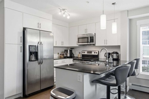 2206-240 Skyview Ranch Road Ne, Calgary, AB - Indoor Photo Showing Kitchen With Upgraded Kitchen