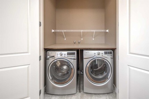 10 Aspenshire Place Sw, Calgary, AB - Indoor Photo Showing Laundry Room