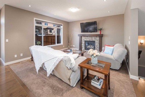 10 Aspenshire Place Sw, Calgary, AB - Indoor Photo Showing Living Room With Fireplace