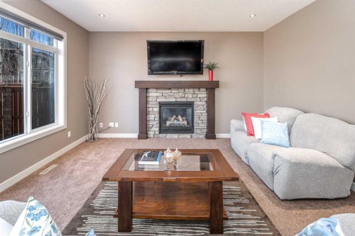 10 Aspenshire Place Sw, Calgary, AB - Indoor Photo Showing Living Room With Fireplace