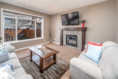 10 Aspenshire Place Sw, Calgary, AB - Indoor Photo Showing Living Room With Fireplace