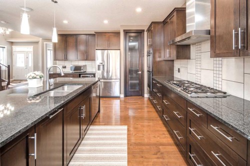 10 Aspenshire Place Sw, Calgary, AB - Indoor Photo Showing Kitchen With Stainless Steel Kitchen With Double Sink With Upgraded Kitchen