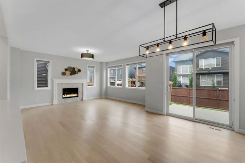45 Carringsby Landing Nw, Calgary, AB - Indoor Photo Showing Living Room With Fireplace