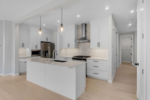 45 Carringsby Landing Nw, Calgary, AB - Indoor Photo Showing Kitchen With Double Sink With Upgraded Kitchen