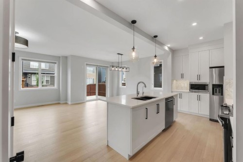 45 Carringsby Landing Nw, Calgary, AB - Indoor Photo Showing Kitchen With Double Sink With Upgraded Kitchen