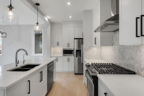 45 Carringsby Landing Nw, Calgary, AB - Indoor Photo Showing Kitchen With Double Sink With Upgraded Kitchen