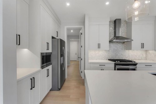 45 Carringsby Landing Nw, Calgary, AB - Indoor Photo Showing Kitchen With Upgraded Kitchen