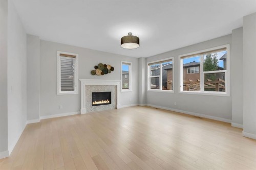 45 Carringsby Landing Nw, Calgary, AB - Indoor Photo Showing Living Room With Fireplace