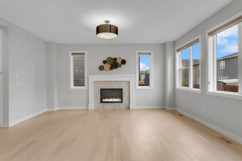45 Carringsby Landing Nw, Calgary, AB - Indoor Photo Showing Living Room With Fireplace