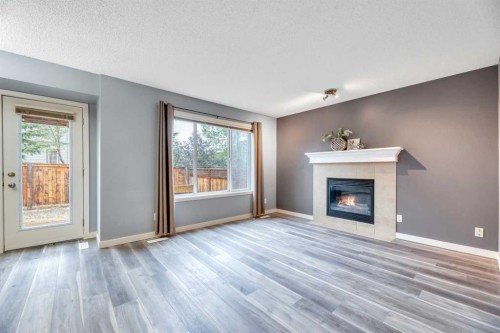142 Ranch Ridge Court, Strathmore, AB - Indoor Photo Showing Living Room With Fireplace