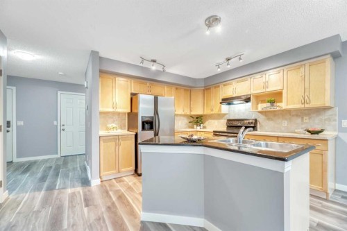 142 Ranch Ridge Court, Strathmore, AB - Indoor Photo Showing Kitchen With Double Sink