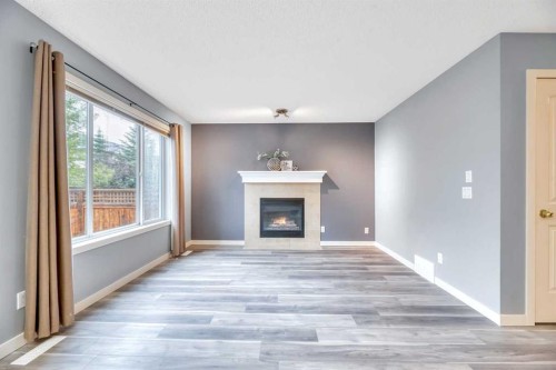 142 Ranch Ridge Court, Strathmore, AB - Indoor Photo Showing Living Room With Fireplace