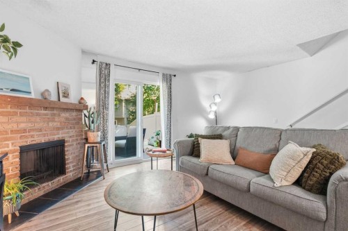 6503 Ranchview Drive Nw, Calgary, AB - Indoor Photo Showing Living Room With Fireplace