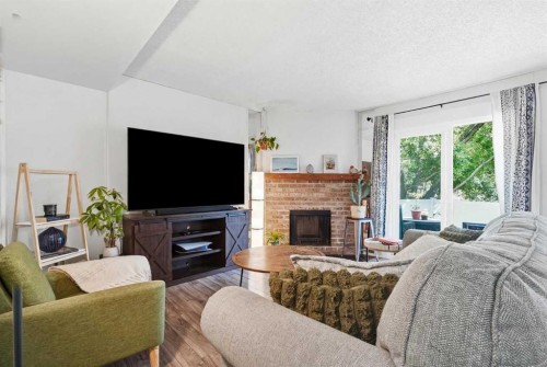 6503 Ranchview Drive Nw, Calgary, AB - Indoor Photo Showing Living Room With Fireplace