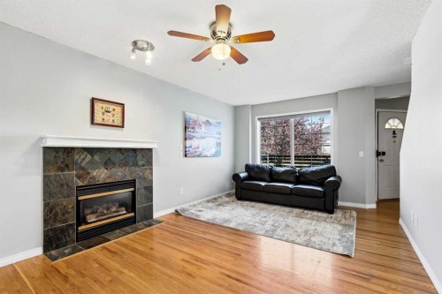 10433 Hidden Valley Drive Nw, Calgary, AB - Indoor Photo Showing Living Room With Fireplace