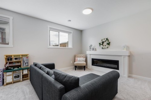 315 Monterey Place Se, High River, AB - Indoor Photo Showing Living Room With Fireplace