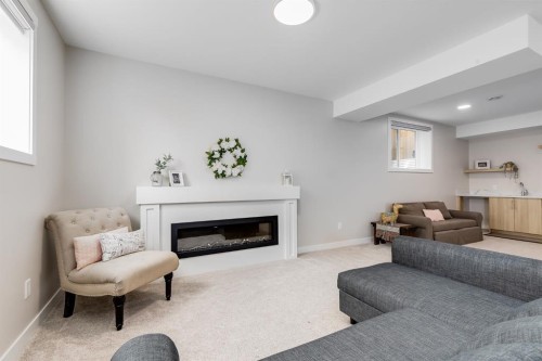 315 Monterey Place Se, High River, AB - Indoor Photo Showing Living Room With Fireplace