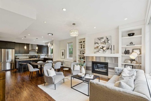 1-922 3 Avenue Nw, Calgary, AB - Indoor Photo Showing Living Room With Fireplace