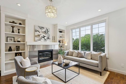 1-922 3 Avenue Nw, Calgary, AB - Indoor Photo Showing Living Room With Fireplace
