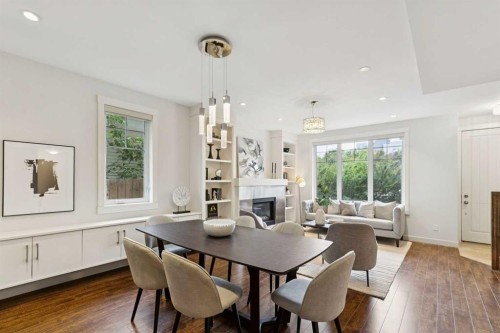 1-922 3 Avenue Nw, Calgary, AB - Indoor Photo Showing Other Room With Fireplace