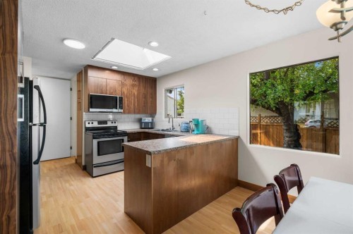 613 Olympia Crescent Se, Calgary, AB - Indoor Photo Showing Kitchen With Stainless Steel Kitchen With Double Sink
