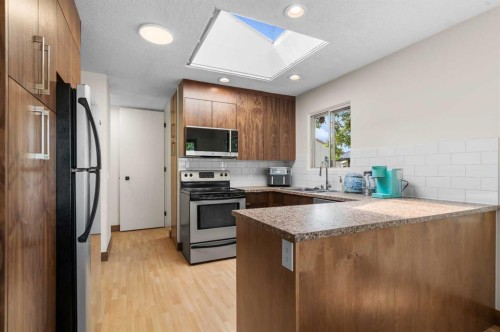 613 Olympia Crescent Se, Calgary, AB - Indoor Photo Showing Kitchen With Stainless Steel Kitchen With Double Sink