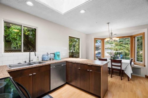 613 Olympia Crescent Se, Calgary, AB - Indoor Photo Showing Kitchen With Double Sink