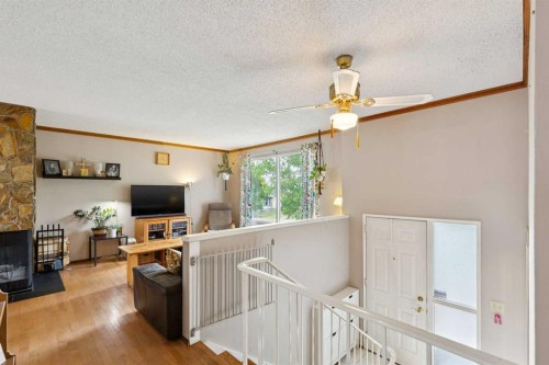 107 Bermuda Drive Nw, Calgary, AB - Indoor With Fireplace