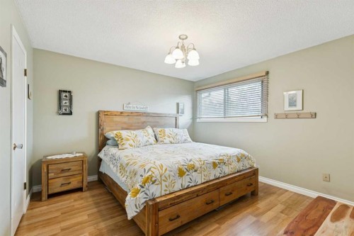 323 Ranchview Place Nw, Calgary, AB - Indoor Photo Showing Bedroom