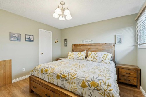 323 Ranchview Place Nw, Calgary, AB - Indoor Photo Showing Bedroom