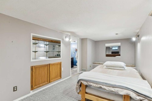 323 Ranchview Place Nw, Calgary, AB - Indoor Photo Showing Bedroom