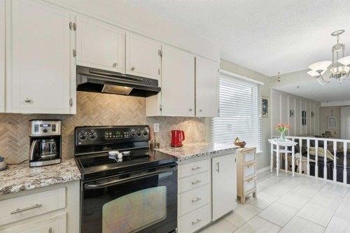 323 Ranchview Place Nw, Calgary, AB - Indoor Photo Showing Kitchen