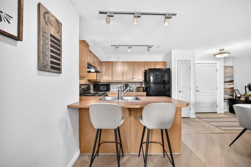 208-30 Cranfield Link Se, Calgary, AB - Indoor Photo Showing Kitchen With Double Sink