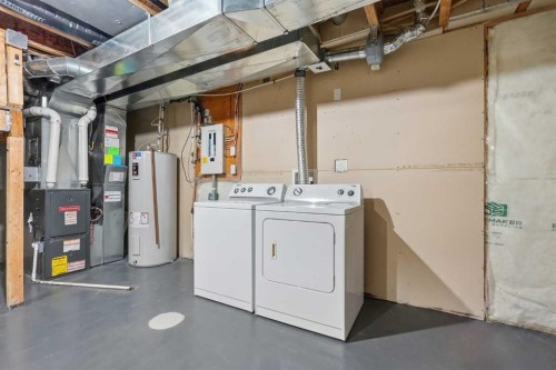 149 Prestwick Villas Se, Calgary, AB - Indoor Photo Showing Laundry Room