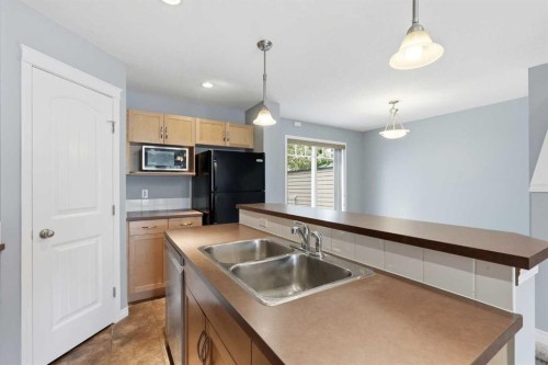 149 Prestwick Villas Se, Calgary, AB - Indoor Photo Showing Kitchen With Double Sink