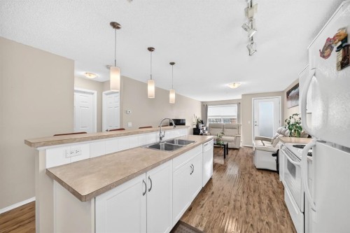 2133-700 Willowbrook Road Nw, Airdrie, AB - Indoor Photo Showing Kitchen With Double Sink