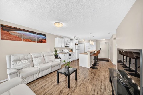 2133-700 Willowbrook Road Nw, Airdrie, AB - Indoor Photo Showing Living Room