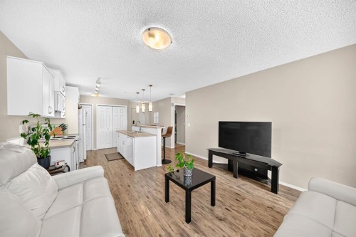 2133-700 Willowbrook Road Nw, Airdrie, AB - Indoor Photo Showing Living Room