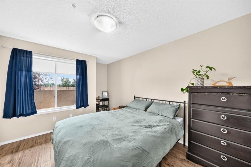 2133-700 Willowbrook Road Nw, Airdrie, AB - Indoor Photo Showing Bedroom