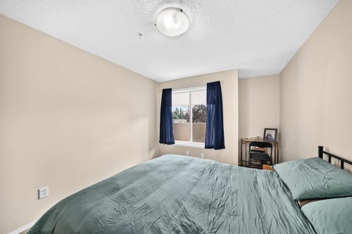 2133-700 Willowbrook Road Nw, Airdrie, AB - Indoor Photo Showing Bedroom