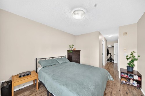 2133-700 Willowbrook Road Nw, Airdrie, AB - Indoor Photo Showing Bedroom