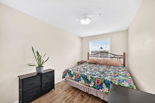 2133-700 Willowbrook Road Nw, Airdrie, AB - Indoor Photo Showing Bedroom