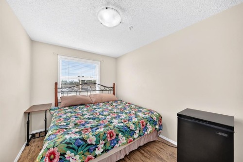 2133-700 Willowbrook Road Nw, Airdrie, AB - Indoor Photo Showing Bedroom